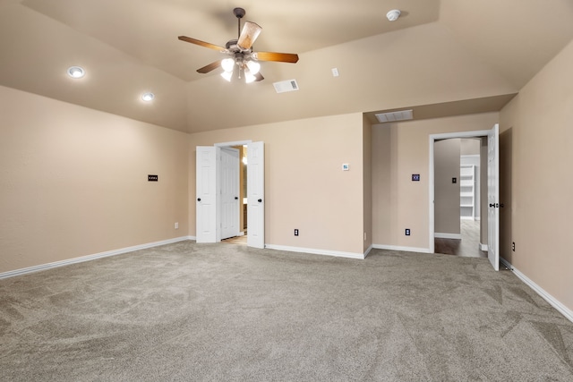 unfurnished bedroom featuring lofted ceiling, carpet, visible vents, and baseboards