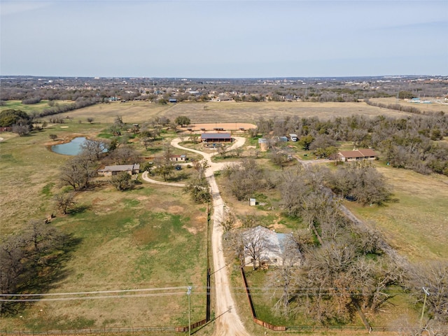 drone / aerial view featuring a rural view and a water view