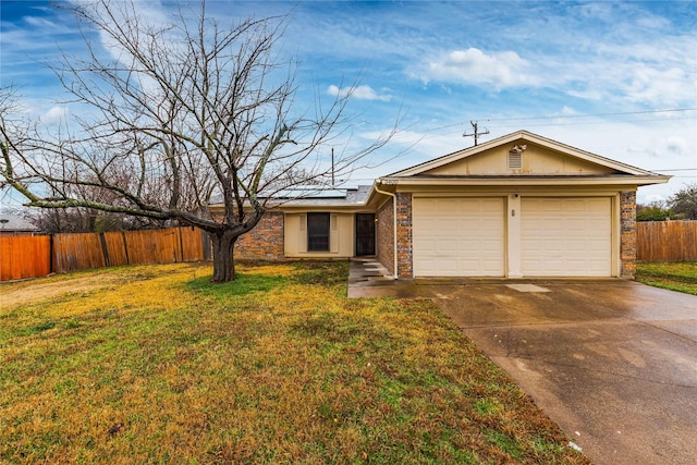 single story home featuring a garage, a front yard, concrete driveway, and fence