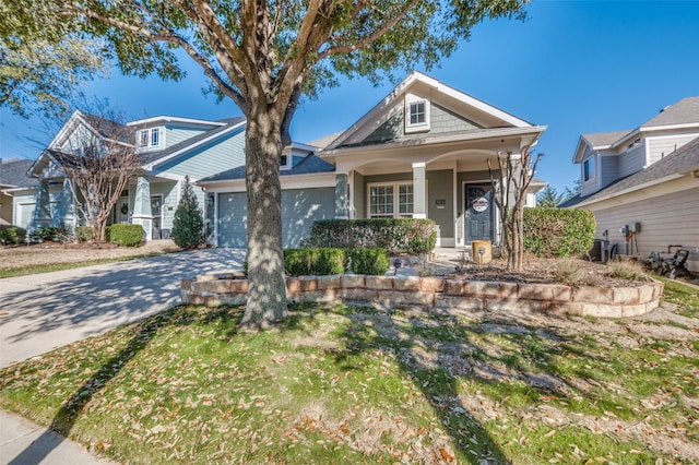 view of front of property with a garage, driveway, and central AC unit