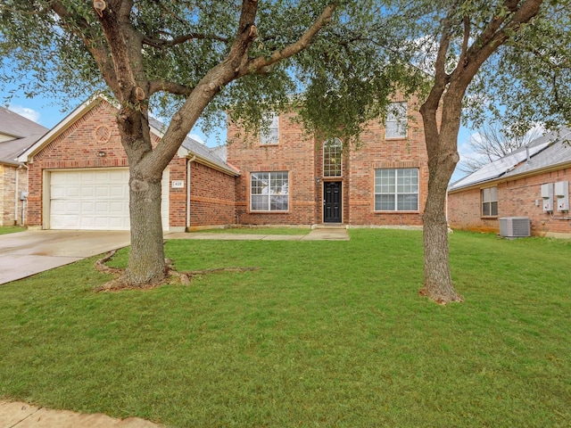 traditional-style home featuring a front yard, concrete driveway, a garage, central air condition unit, and brick siding