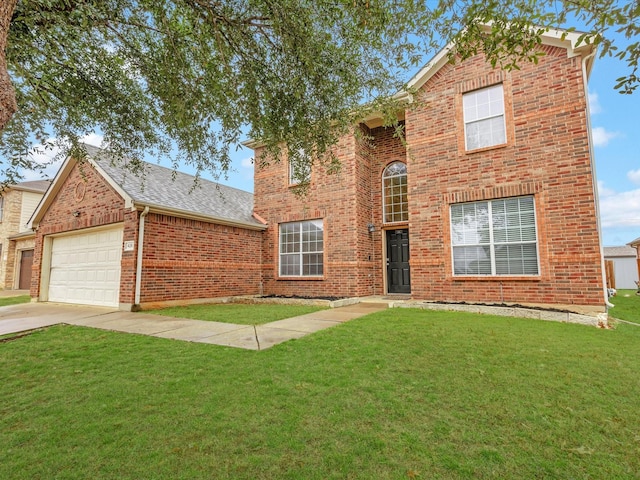 traditional-style house featuring a garage, a front lawn, concrete driveway, and brick siding