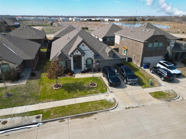 bird's eye view with a water view and a residential view