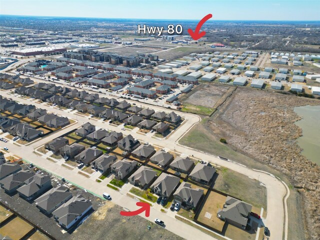 aerial view with a water view and a residential view