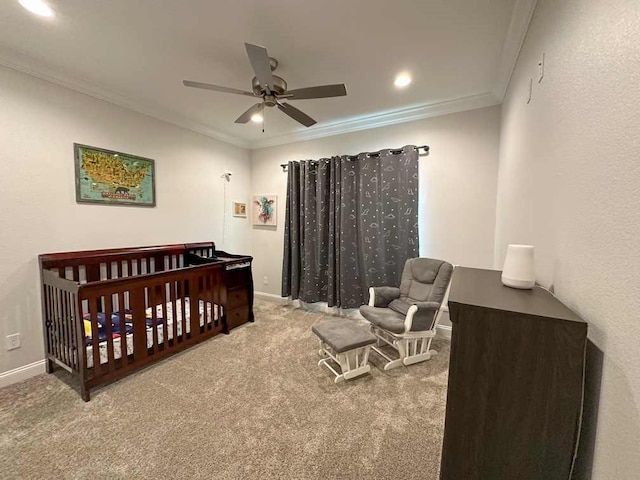 bedroom with recessed lighting, carpet flooring, a crib, and ornamental molding