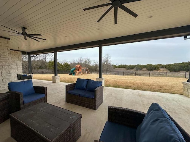 view of patio featuring an outdoor living space, a fenced backyard, ceiling fan, and a playground
