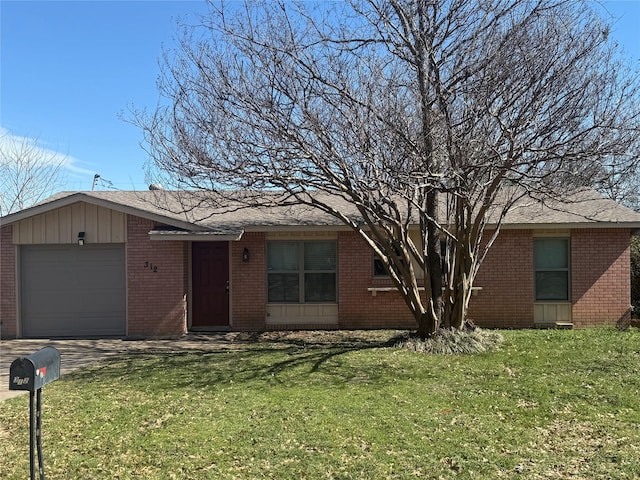 single story home featuring a garage, driveway, brick siding, and a front yard