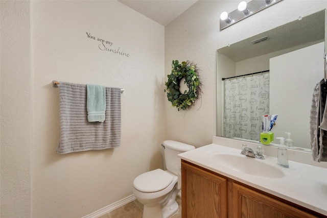 full bathroom with toilet, visible vents, vanity, and baseboards