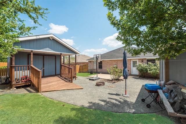 view of yard featuring an outdoor fire pit, a patio area, and fence