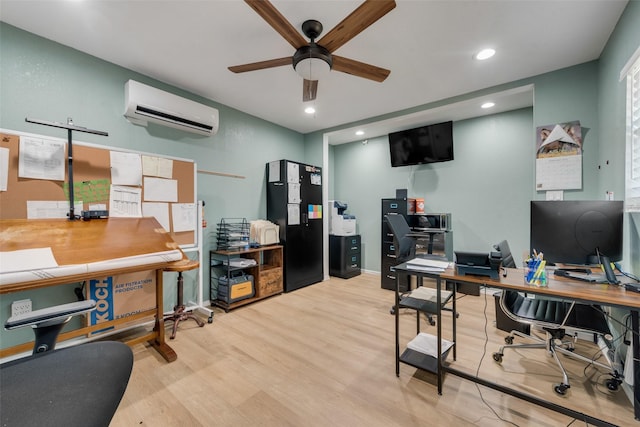 office space featuring ceiling fan, light wood-type flooring, a wall unit AC, and recessed lighting