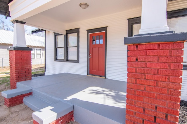 entrance to property with covered porch