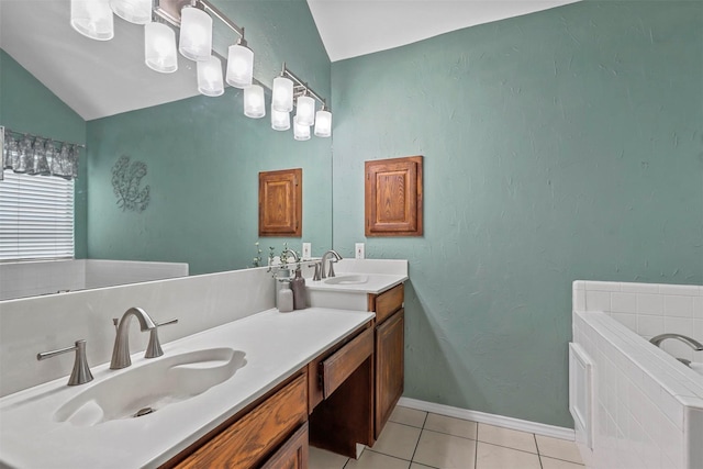 full bathroom with a washtub, vaulted ceiling, vanity, tile patterned flooring, and baseboards