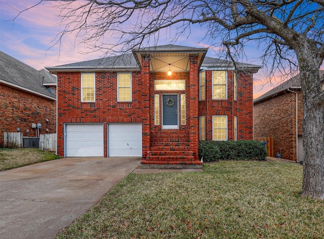 view of front of house featuring concrete driveway, brick siding, an attached garage, and a front lawn