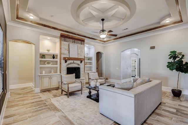 7101 Bridges Ave, Richland Hills, TX 76118 - living room featuring arched walkways, a raised ceiling, and a ceiling fan