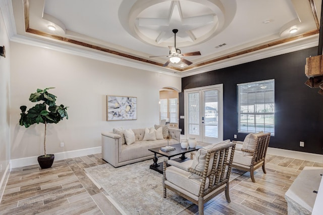 7101 Bridges Ave, Richland Hills, TX 76118 - living area featuring light wood-type flooring, baseboards, a tray ceiling, and crown molding