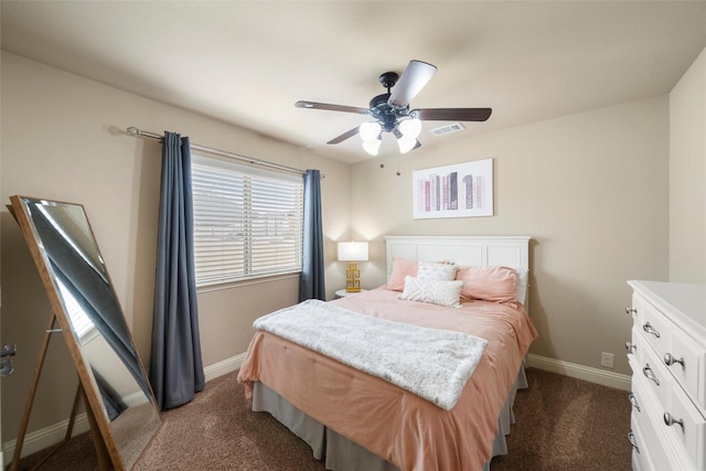 bedroom featuring a ceiling fan, dark colored carpet, visible vents, and baseboards