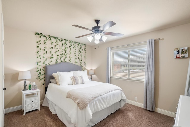 bedroom with ceiling fan, baseboards, and dark carpet