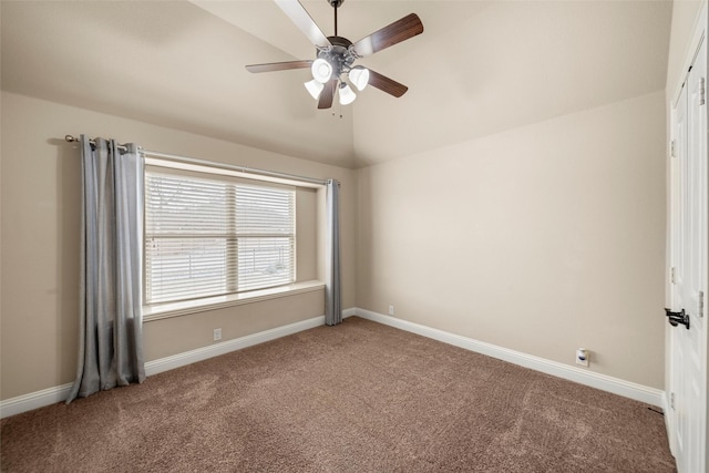 unfurnished room featuring a ceiling fan, carpet flooring, vaulted ceiling, and baseboards