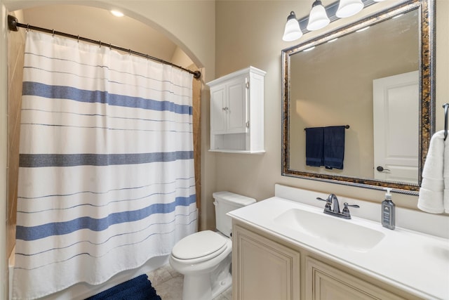 full bath featuring a shower with shower curtain, vanity, toilet, and tile patterned floors