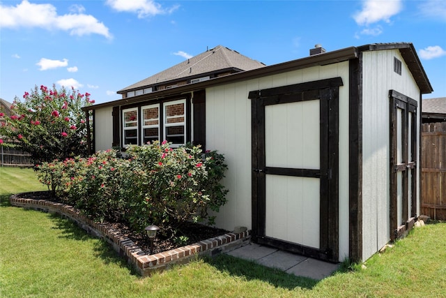 view of shed with fence