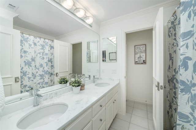 full bath featuring ornamental molding, tile patterned floors, a sink, and double vanity