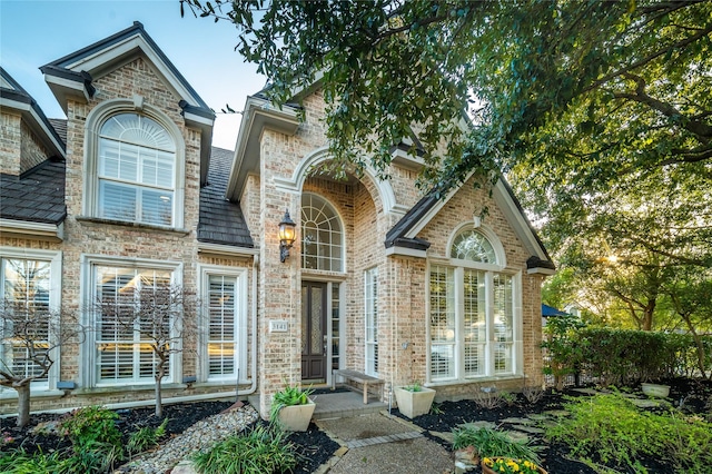 view of front of home with brick siding