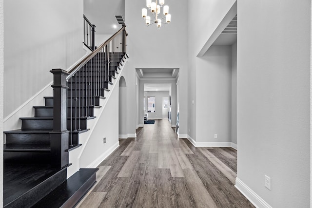 1305 Redbrick Ln, Northlake, TX 76247 - foyer entrance with wood finished floors, a chandelier, stairway, baseboards, and a towering ceiling