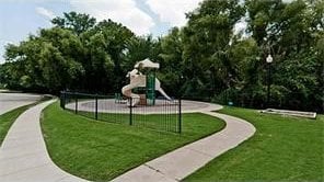 view of community with playground community and a yard