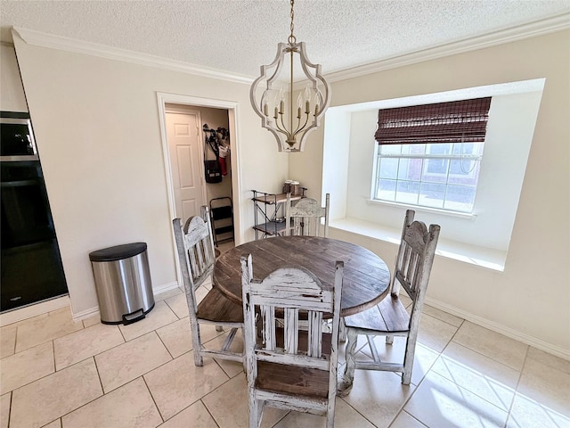 dining room with ornamental molding, a textured ceiling, baseboards, and light tile patterned floors