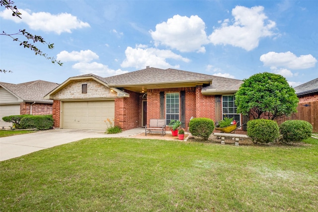 ranch-style home with a front yard, brick siding, driveway, and an attached garage