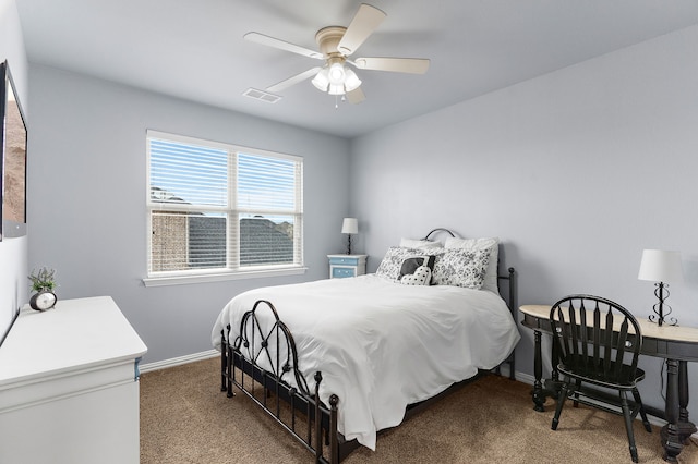 bedroom with a ceiling fan, baseboards, visible vents, and carpet flooring