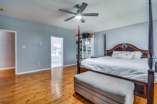 bedroom featuring a textured ceiling, ceiling fan, wood finished floors, and baseboards