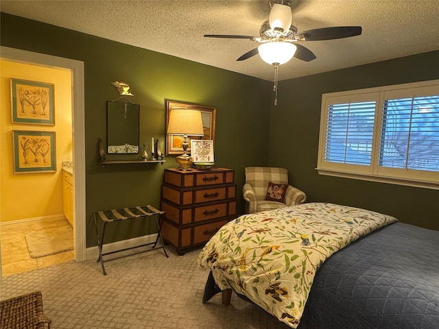 bedroom featuring carpet floors, a textured ceiling, baseboards, and a ceiling fan