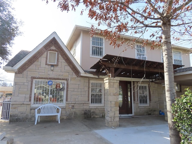 view of front of property featuring stone siding