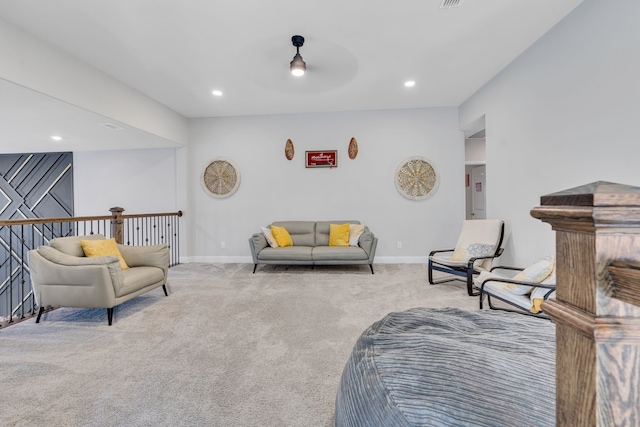 living room with light carpet, baseboards, and recessed lighting