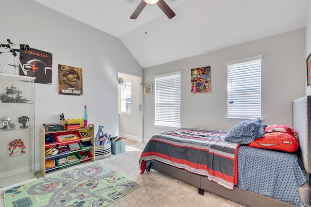 carpeted bedroom with vaulted ceiling, ceiling fan, and baseboards