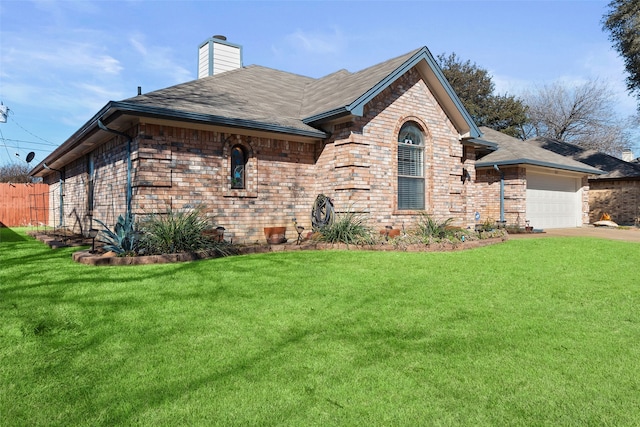 view of front of property with a garage, brick siding, concrete driveway, a chimney, and a front yard