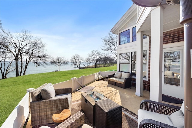 view of patio featuring a water view and outdoor lounge area