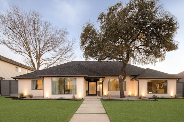 16912 Park Hill Dr, Dallas, TX 75248 - view of front of house with a shingled roof, a front lawn, and stucco siding