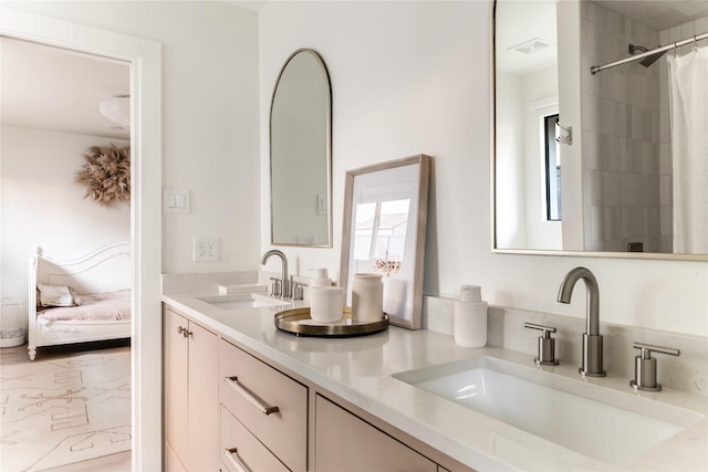 16912 Park Hill Dr, Dallas, TX 75248 - ensuite bathroom featuring ensuite bath, a sink, visible vents, and double vanity