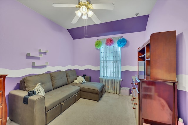 living room featuring lofted ceiling, ceiling fan, and light carpet