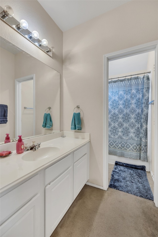 bathroom with vanity and a shower with shower curtain