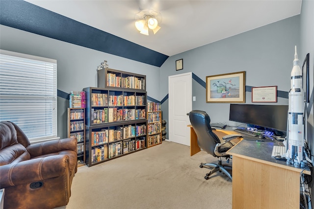 office space with light carpet, vaulted ceiling, and ceiling fan