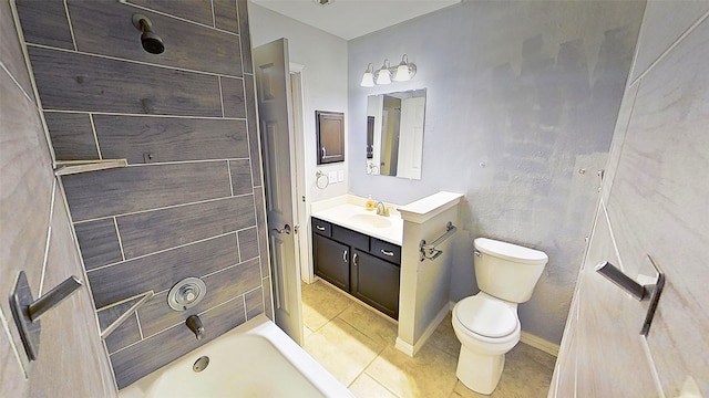 bathroom featuring toilet, vanity, a tub, baseboards, and tile patterned floors