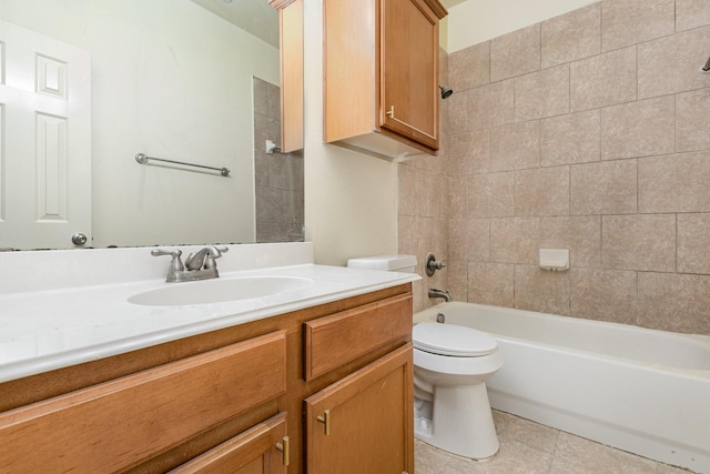 bathroom featuring toilet, vanity, washtub / shower combination, and tile patterned floors