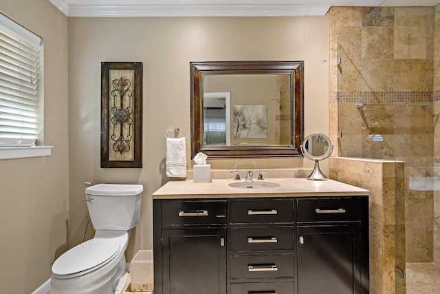 full bath with toilet, ornamental molding, a stall shower, and vanity