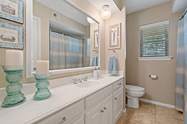 bathroom featuring toilet, baseboards, visible vents, and vanity