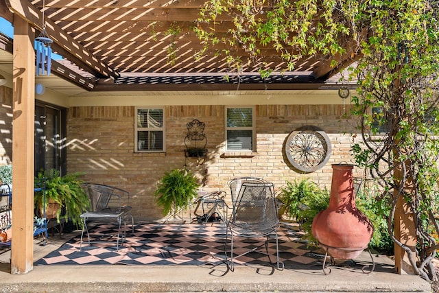 view of patio featuring a pergola