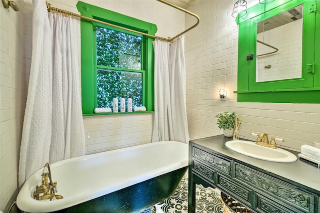 bathroom featuring tile walls, shower / bathtub combination with curtain, and vanity