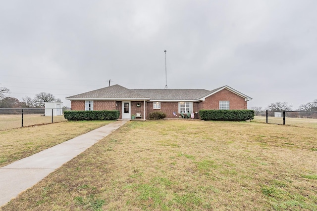 single story home featuring brick siding, a front yard, and fence